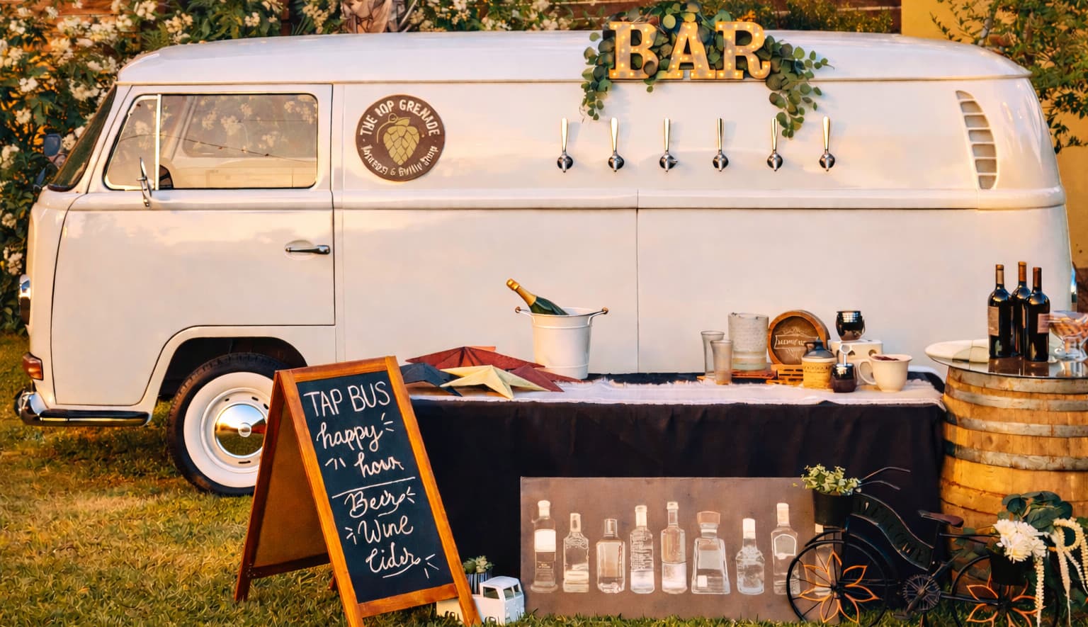 White vintage VW bus converted into a mobile bar with beer taps and chalkboard menu.